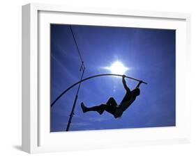 Silhouette of Male Pole Vaulter-Steven Sutton-Framed Photographic Print