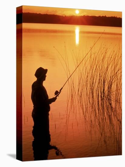 Silhouette of Man Fishing, Vilas City, WI-Ken Wardius-Stretched Canvas