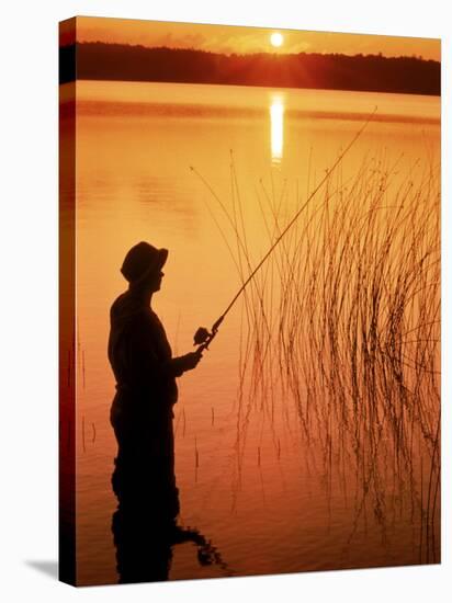 Silhouette of Man Fishing, Vilas City, WI-Ken Wardius-Stretched Canvas