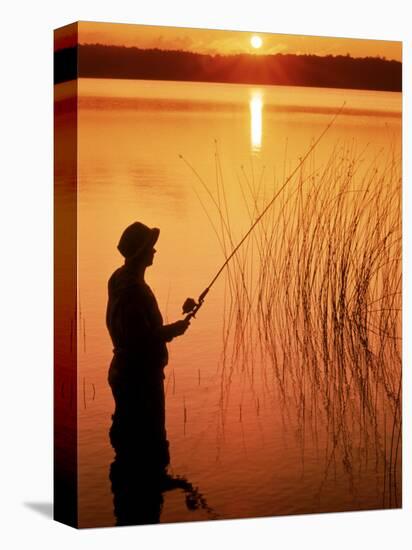 Silhouette of Man Fishing, Vilas City, WI-Ken Wardius-Stretched Canvas