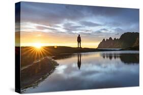 Silhouette of man standing on rocks watching the mountain peaks at sunset, Tungeneset viewpoint-Roberto Moiola-Stretched Canvas