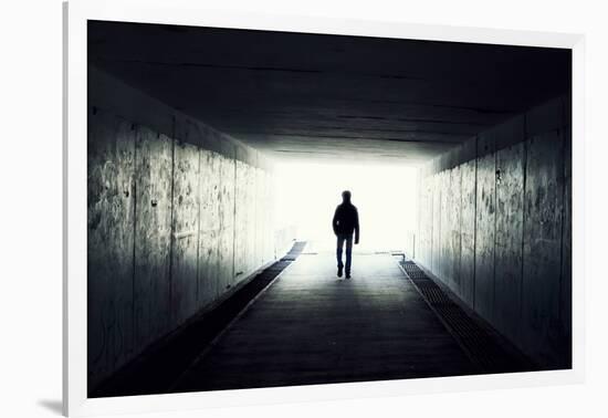 Silhouette Of Man Walking In Tunnel. Light At End Of Tunnel-Gladkov-Framed Art Print