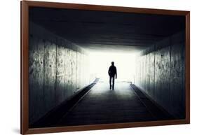 Silhouette Of Man Walking In Tunnel. Light At End Of Tunnel-Gladkov-Framed Art Print