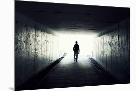 Silhouette Of Man Walking In Tunnel. Light At End Of Tunnel-Gladkov-Mounted Art Print