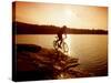 Silhouette of Mountain Biker at Sunset-null-Stretched Canvas