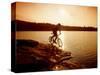 Silhouette of Mountain Biker at Sunset-null-Stretched Canvas