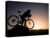 Silhouette of Mountain Biker at the Summit During Sunrise-null-Stretched Canvas