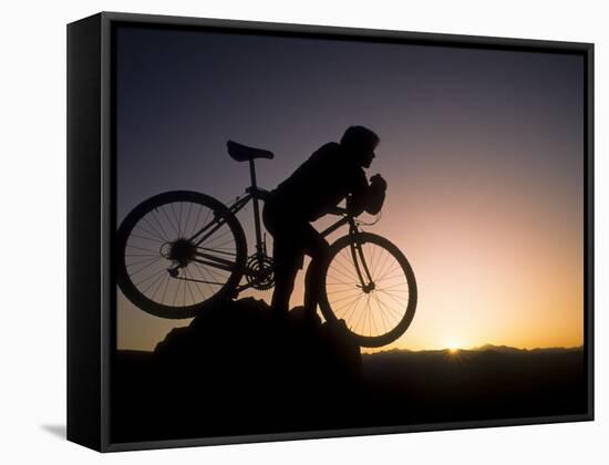 Silhouette of Mountain Biker at the Summit During Sunrise-null-Framed Stretched Canvas