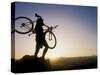 Silhouette of Mountain Biker at the Summit During Sunrise-null-Stretched Canvas