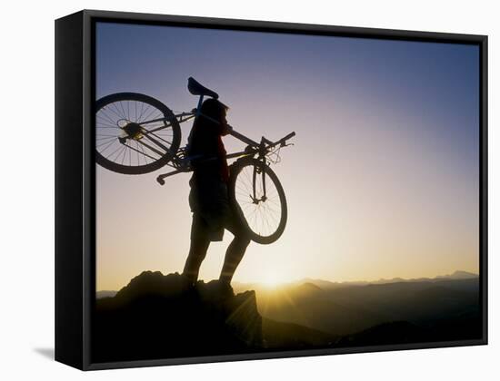 Silhouette of Mountain Biker at the Summit During Sunrise-null-Framed Stretched Canvas