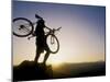 Silhouette of Mountain Biker at the Summit During Sunrise-null-Mounted Premium Photographic Print