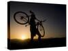 Silhouette of Mountain Biker at the Summit During Sunrise-null-Stretched Canvas