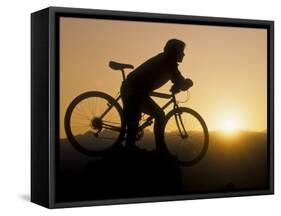 Silhouette of Mountain Biker at the Summit During Sunrise-null-Framed Stretched Canvas