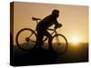 Silhouette of Mountain Biker at the Summit During Sunrise-null-Stretched Canvas