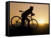 Silhouette of Mountain Biker at the Summit During Sunrise-null-Framed Stretched Canvas