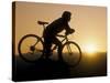Silhouette of Mountain Biker at the Summit During Sunrise-null-Stretched Canvas
