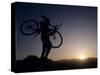 Silhouette of Mountain Biker at the Summit During Sunrise-null-Stretched Canvas