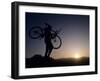 Silhouette of Mountain Biker at the Summit During Sunrise-null-Framed Photographic Print