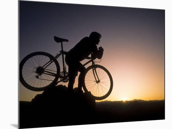 Silhouette of Mountain Biker at the Summit During Sunrise-null-Mounted Photographic Print