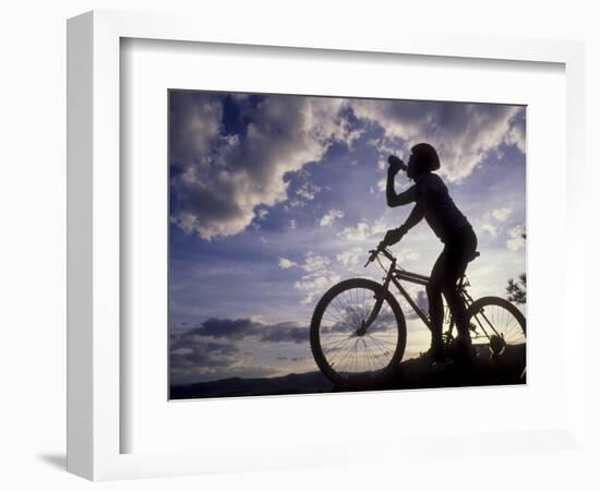 Silhouette of Mountain Biker Drinking at the Summit During Sunset-null-Framed Photographic Print