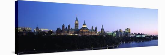 Silhouette of Parliament Building along a Lake, Ottawa, Ontario, Canada-null-Stretched Canvas