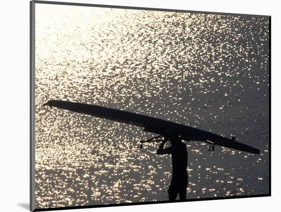 Silhouette of Rower Carrying His Boat, Vancouver Lake, Georgia, USA-null-Mounted Photographic Print