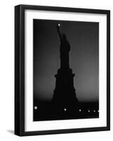 Silhouette of Statue of Liberty Lit by Two 200 Watt Lamps During Wartime Effort to Conserve Energy-Andreas Feininger-Framed Photographic Print