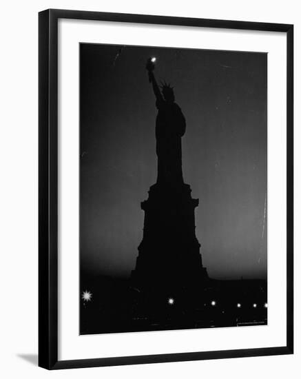 Silhouette of Statue of Liberty Lit by Two 200 Watt Lamps During Wartime Effort to Conserve Energy-Andreas Feininger-Framed Photographic Print