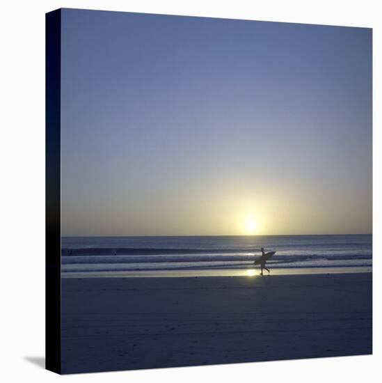 Silhouette of Surfer Walking on Avellanas Beach, Nicoya Peninsula, Costa Rica, Central America-Aaron McCoy-Stretched Canvas