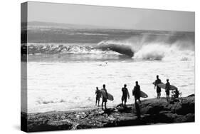 Silhouette of surfers standing on the beach, Australia-null-Stretched Canvas