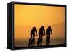 Silhouette of Three Men Riding on the Beach-Mitch Diamond-Framed Stretched Canvas