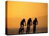 Silhouette of Three Men Riding on the Beach-Mitch Diamond-Stretched Canvas