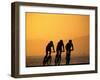 Silhouette of Three Men Riding on the Beach-Mitch Diamond-Framed Premium Photographic Print