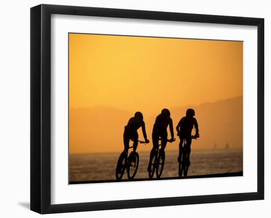 Silhouette of Three Men Riding on the Beach-Mitch Diamond-Framed Premium Photographic Print