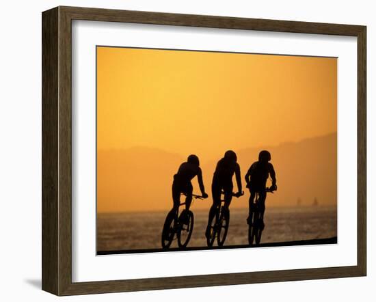 Silhouette of Three Men Riding on the Beach-Mitch Diamond-Framed Photographic Print