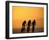 Silhouette of Three Men Riding on the Beach-Mitch Diamond-Framed Photographic Print