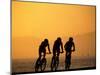 Silhouette of Three Men Riding on the Beach-Mitch Diamond-Mounted Photographic Print