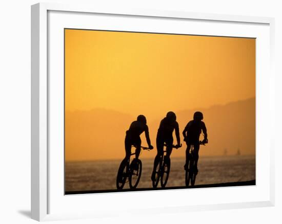 Silhouette of Three Men Riding on the Beach-Mitch Diamond-Framed Photographic Print