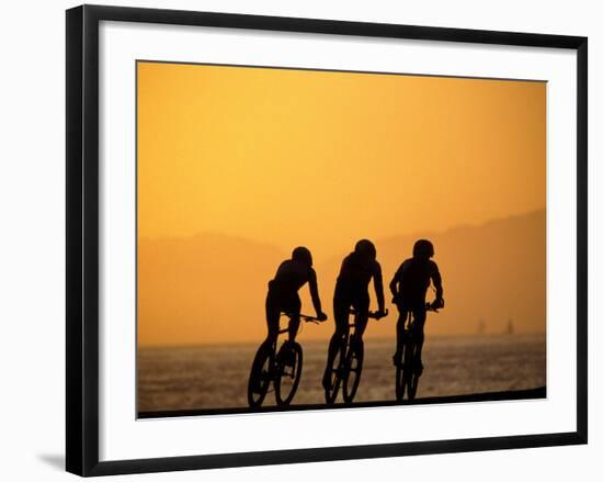 Silhouette of Three Men Riding on the Beach-Mitch Diamond-Framed Photographic Print