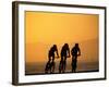 Silhouette of Three Men Riding on the Beach-Mitch Diamond-Framed Photographic Print