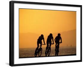 Silhouette of Three Men Riding on the Beach-Mitch Diamond-Framed Photographic Print