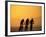 Silhouette of Three Men Riding on the Beach-Mitch Diamond-Framed Photographic Print