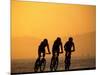 Silhouette of Three Men Riding on the Beach-Mitch Diamond-Mounted Photographic Print