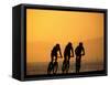 Silhouette of Three Men Riding on the Beach-Mitch Diamond-Framed Stretched Canvas