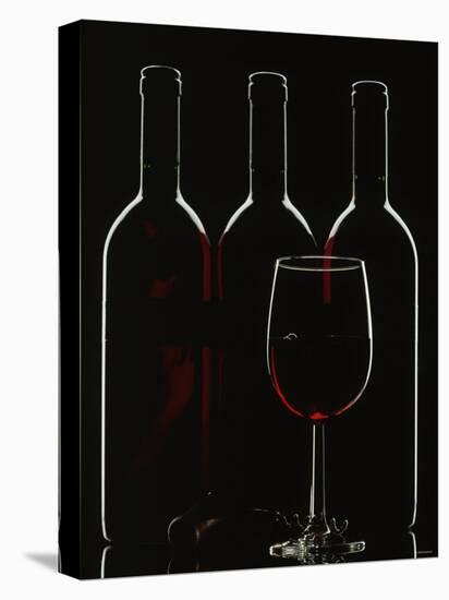 Silhouette of Three Red Wine Bottles and One Red Wine Glass-Walter Cimbal-Stretched Canvas