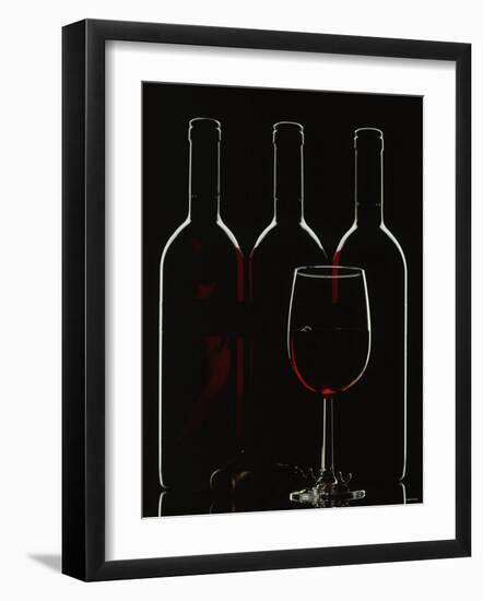 Silhouette of Three Red Wine Bottles and One Red Wine Glass-Walter Cimbal-Framed Photographic Print