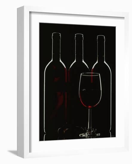 Silhouette of Three Red Wine Bottles and One Red Wine Glass-Walter Cimbal-Framed Photographic Print