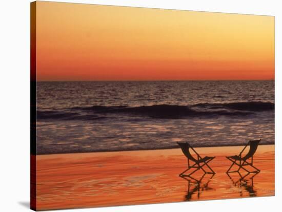 Silhouette of Two Chairs on the Beach-Mitch Diamond-Stretched Canvas