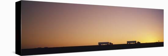 Silhouette of Two Trucks Moving on a Highway, Interstate 5, California, USA-null-Stretched Canvas