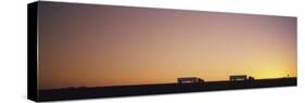 Silhouette of Two Trucks Moving on a Highway, Interstate 5, California, USA-null-Stretched Canvas